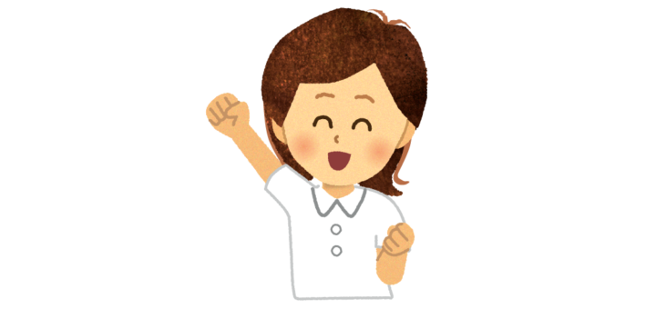 ガッツポーズをする看護師