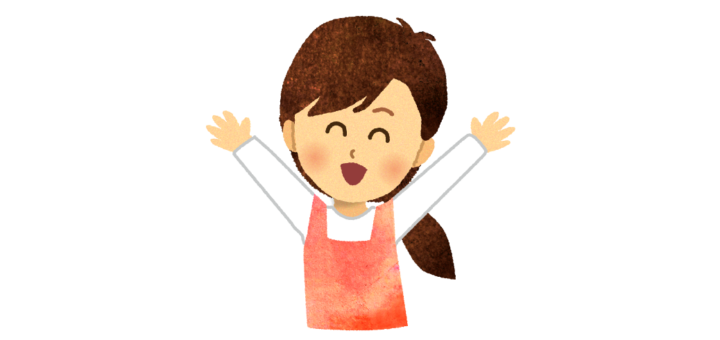 万歳をするエプロンの女性